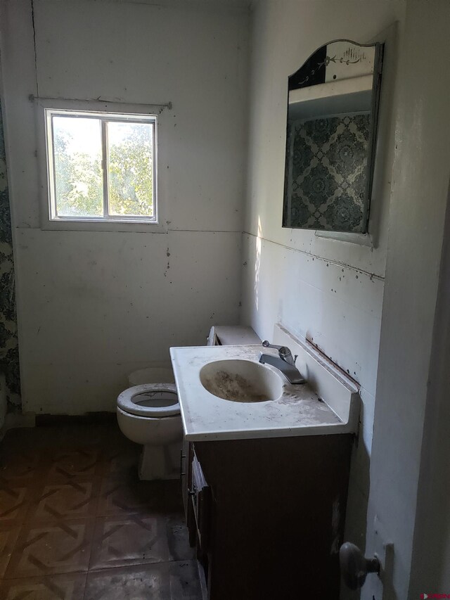 bathroom featuring vanity and toilet