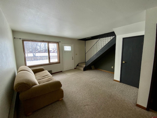 living room with light colored carpet and a textured ceiling