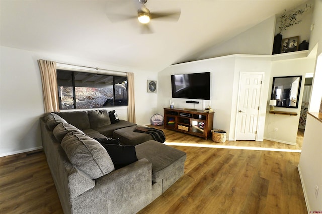 living room with ceiling fan, hardwood / wood-style floors, and lofted ceiling