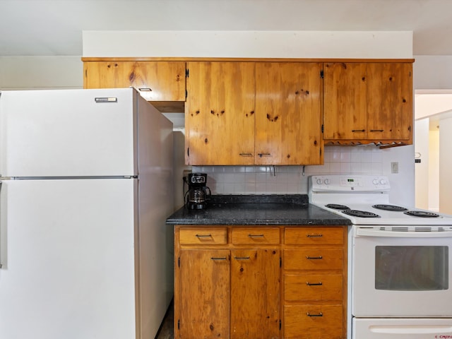 kitchen featuring decorative backsplash and white appliances