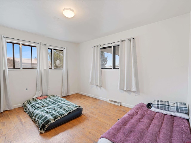 bedroom featuring wood-type flooring