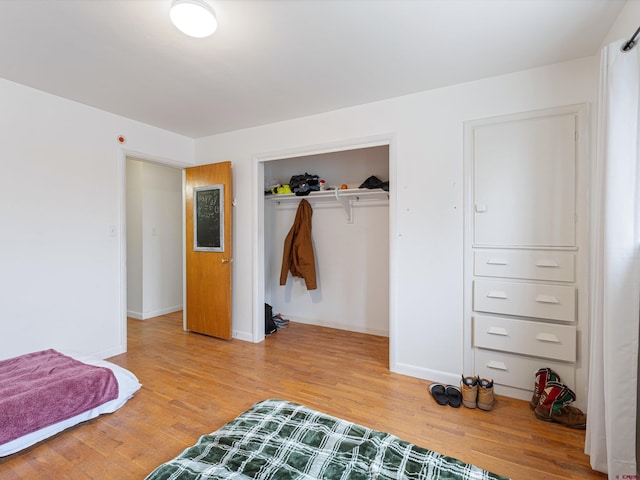 bedroom featuring a closet and hardwood / wood-style flooring