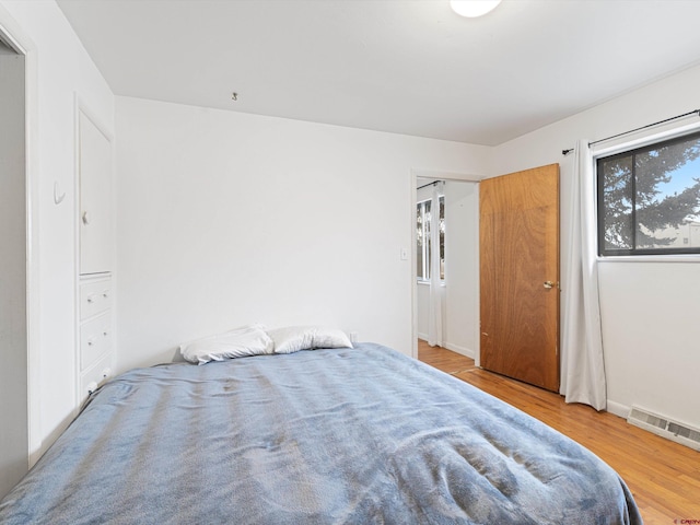 bedroom with wood-type flooring