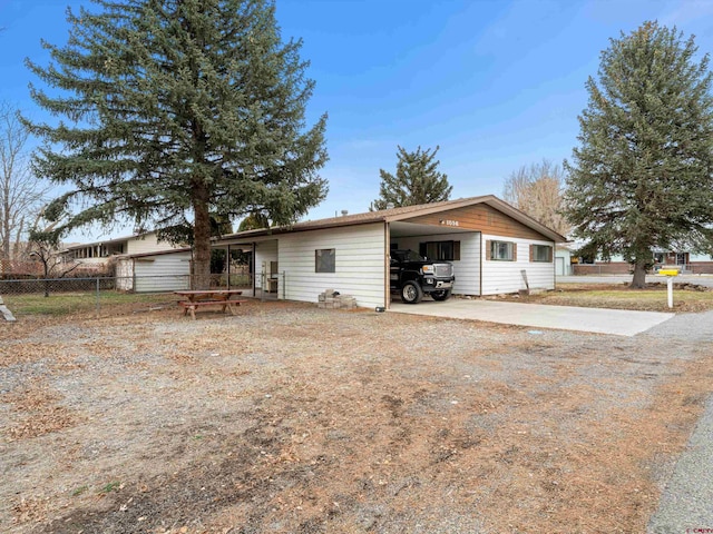 view of front of property with a carport