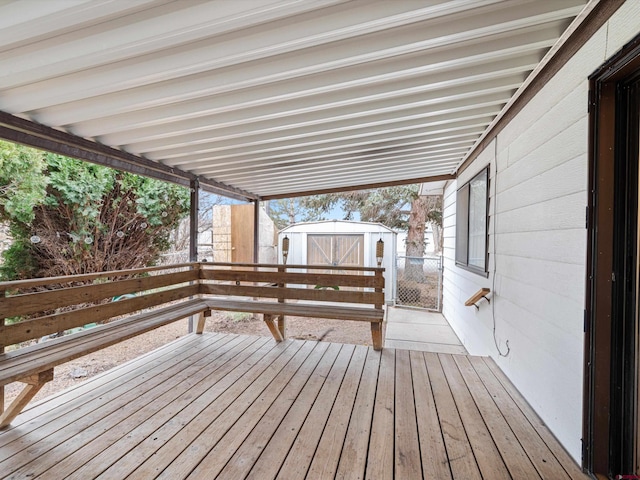 wooden deck with a shed