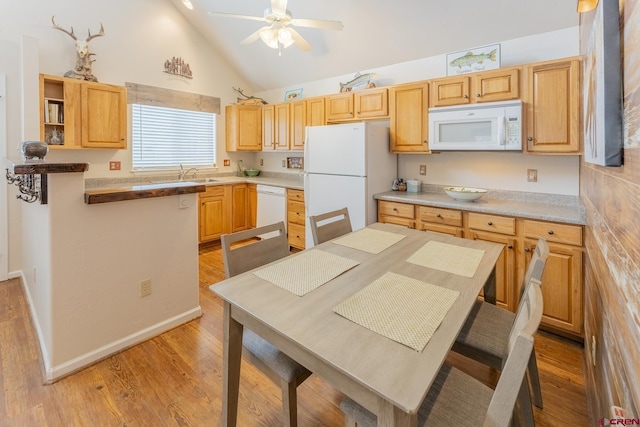 kitchen with white appliances, ceiling fan, sink, high vaulted ceiling, and light hardwood / wood-style floors