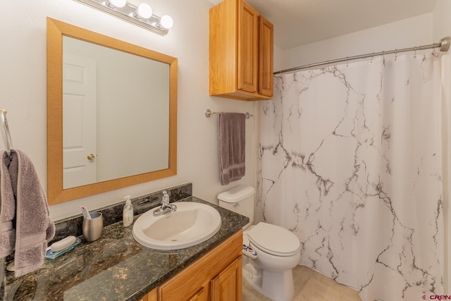 bathroom featuring walk in shower, vanity, and toilet