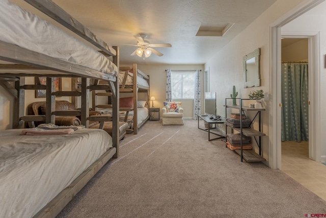 bedroom featuring light colored carpet and ceiling fan