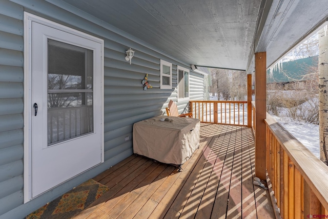 view of snow covered deck