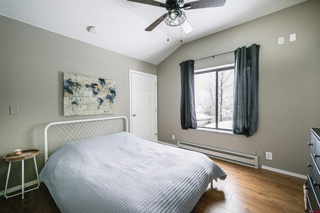 bedroom with ceiling fan, lofted ceiling, dark wood-type flooring, and a baseboard radiator