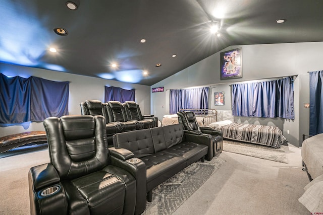 cinema with carpet flooring and lofted ceiling