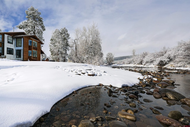 view of yard layered in snow