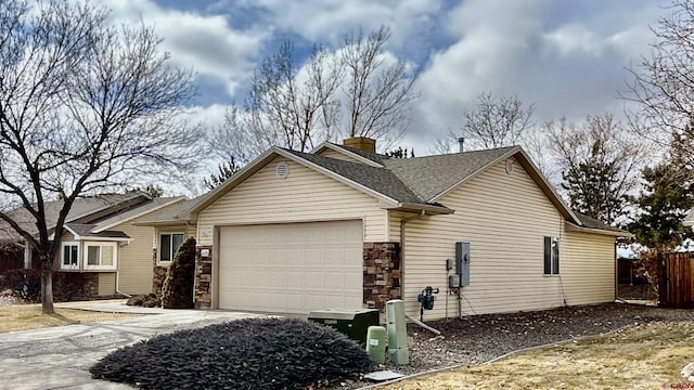 ranch-style home featuring a garage