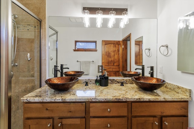 bathroom with vanity and an enclosed shower