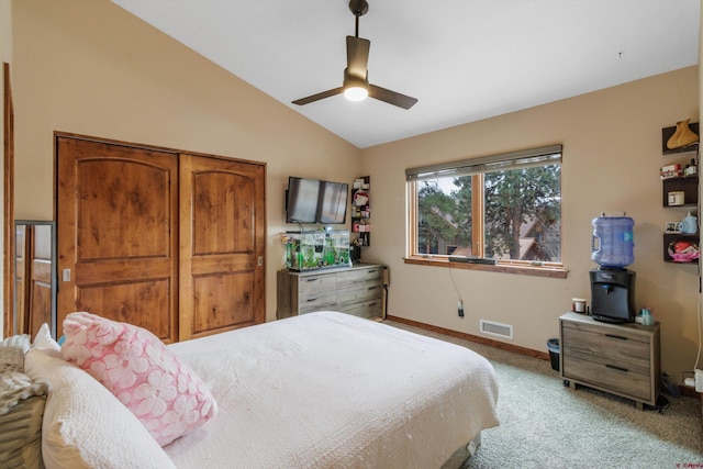 bedroom with light carpet, ceiling fan, and lofted ceiling