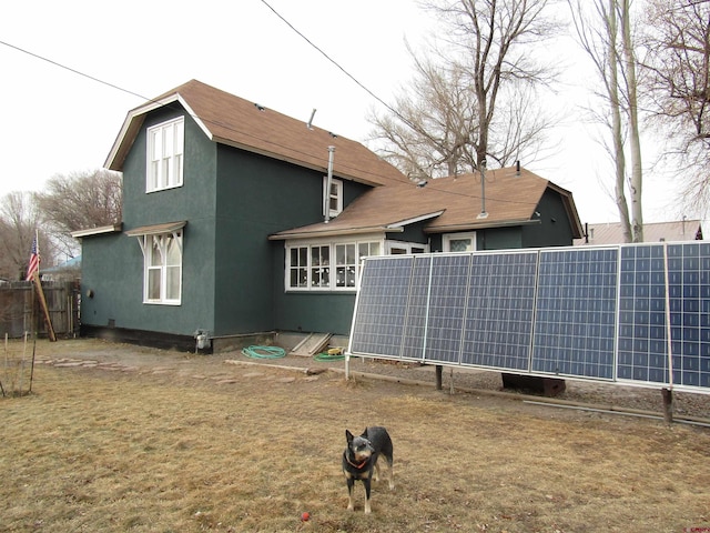 back of property with solar panels