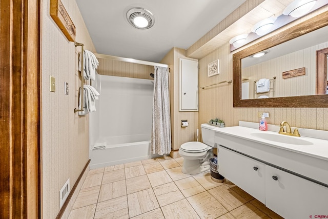 full bathroom featuring shower / bath combination with curtain, toilet, and vanity