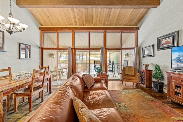 living room featuring beamed ceiling, dark hardwood / wood-style floors, high vaulted ceiling, and a notable chandelier