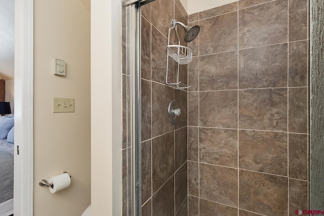 bathroom with a shower with shower door