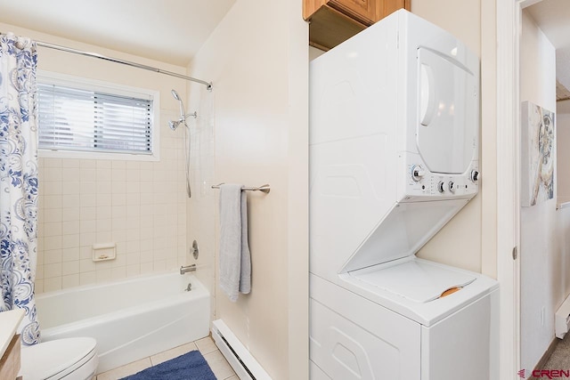 bathroom featuring shower / bathtub combination with curtain, a baseboard radiator, tile patterned flooring, stacked washer and dryer, and toilet