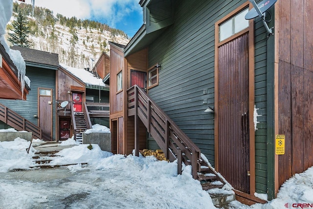 snow covered property with a mountain view