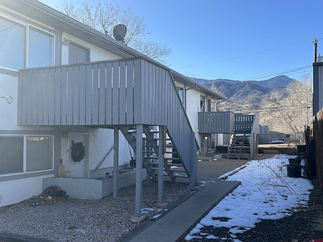 view of snow covered exterior with a mountain view