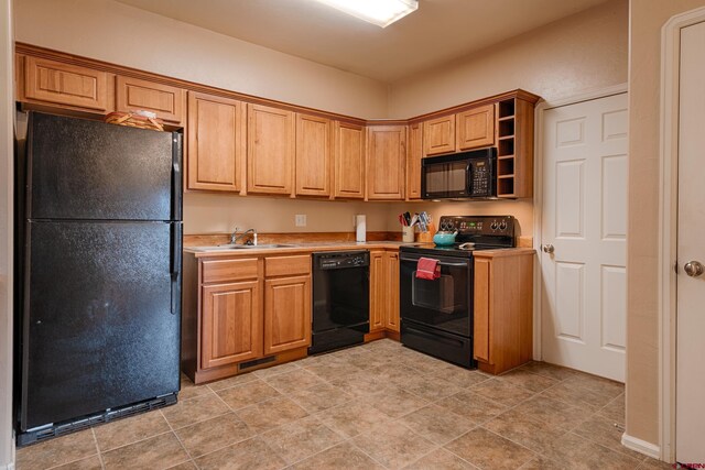 kitchen featuring sink and black appliances