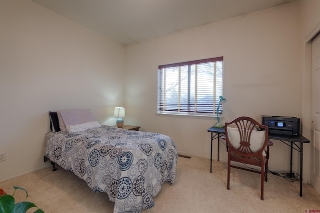 bedroom featuring light carpet