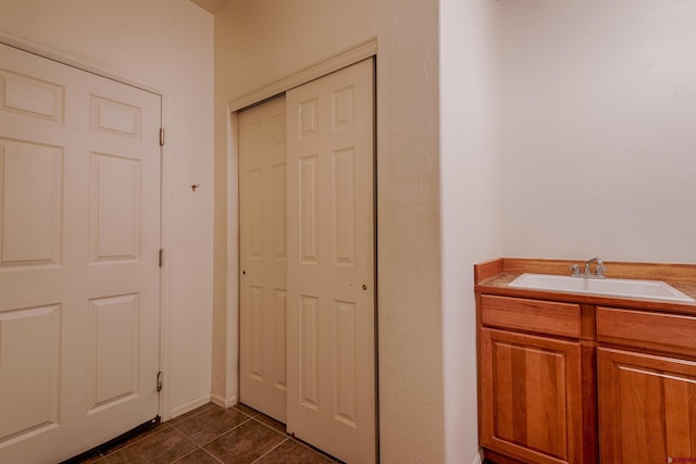 bathroom featuring tile patterned flooring and vanity