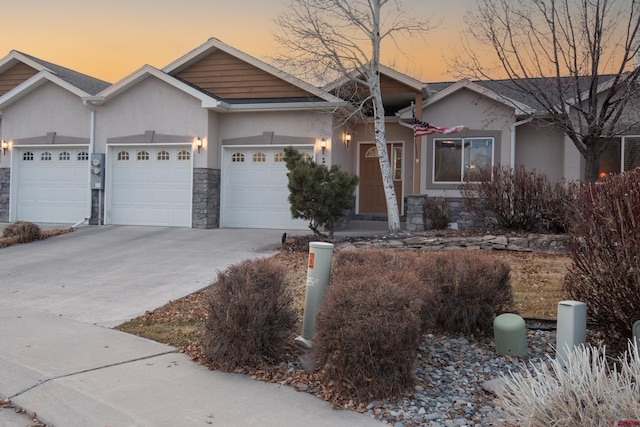 ranch-style home featuring a garage