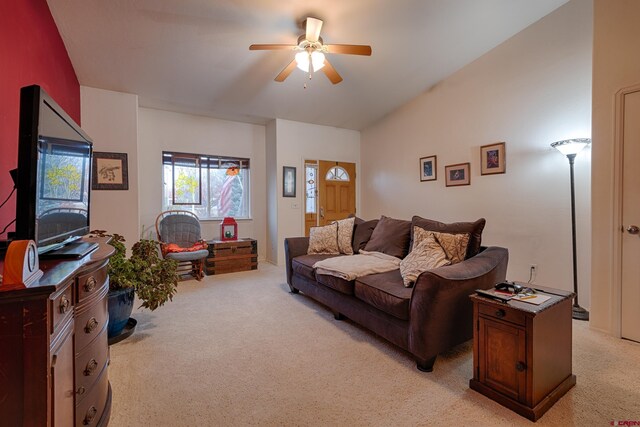 carpeted living room featuring ceiling fan