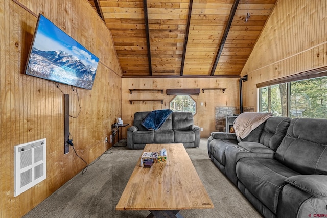 carpeted living room with beamed ceiling, wood walls, wooden ceiling, and heating unit