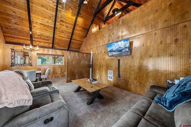 carpeted living room with beam ceiling, wooden walls, high vaulted ceiling, and wooden ceiling