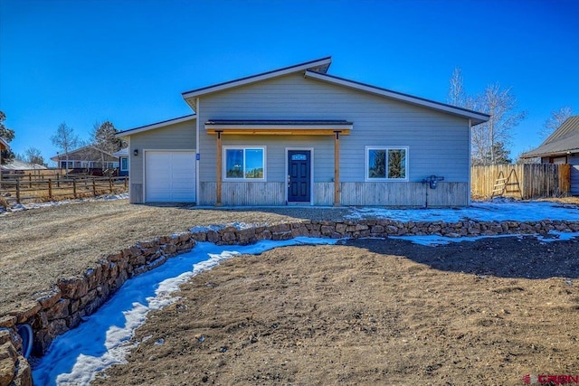 view of front of property with a garage