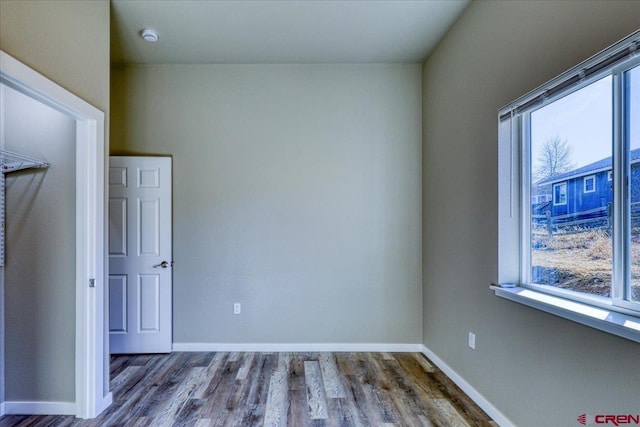 unfurnished room featuring hardwood / wood-style floors