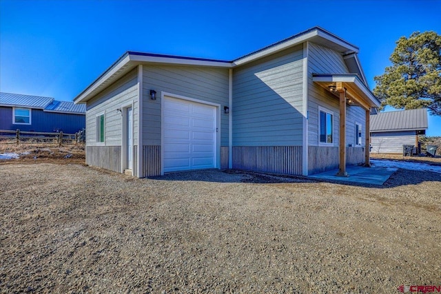 view of property exterior featuring a garage