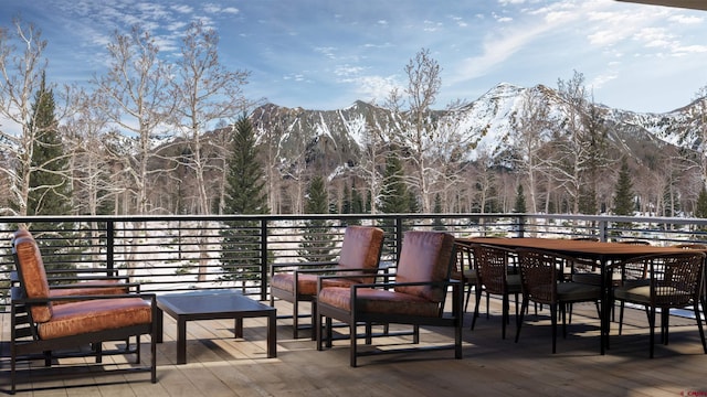 wooden terrace with a mountain view