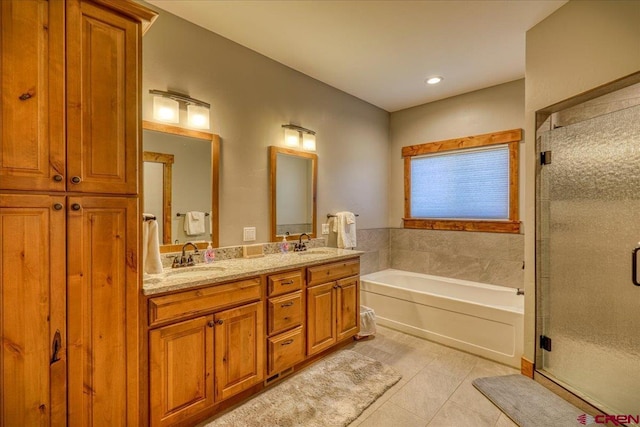 bathroom with separate shower and tub, tile patterned flooring, and vanity