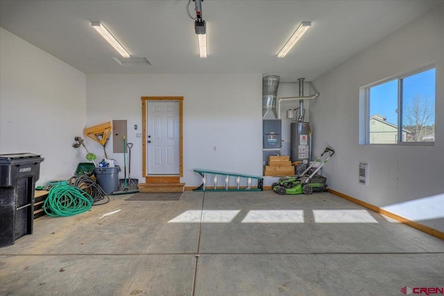 garage featuring electric panel and water heater