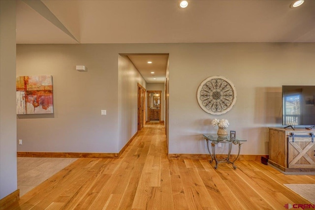 corridor with light wood-type flooring