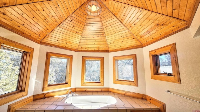 bathroom featuring vaulted ceiling, tiled tub, and wood ceiling