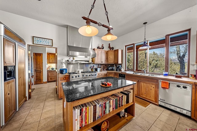 kitchen with light tile patterned floors, a center island, stainless steel appliances, and pendant lighting