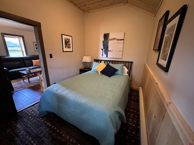 bedroom with hardwood / wood-style floors, wood ceiling, and vaulted ceiling