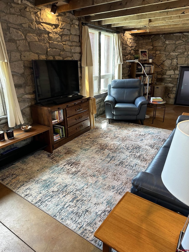 living room featuring beamed ceiling