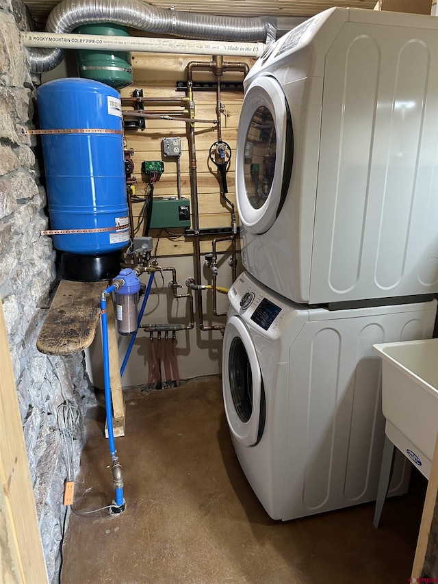 washroom with stacked washer / drying machine