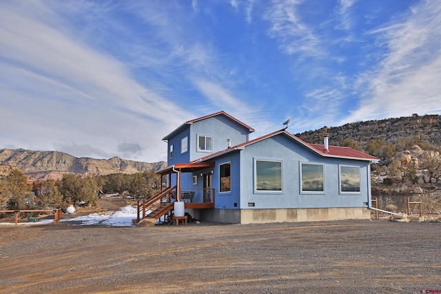 view of front of home featuring a mountain view