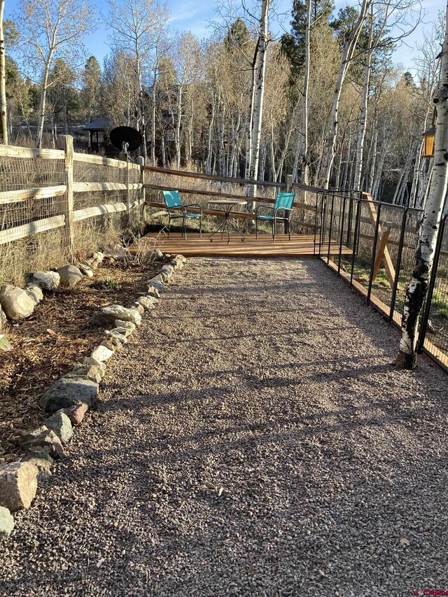 view of yard with a wooden deck