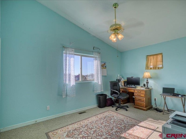 office featuring ceiling fan, light colored carpet, and lofted ceiling