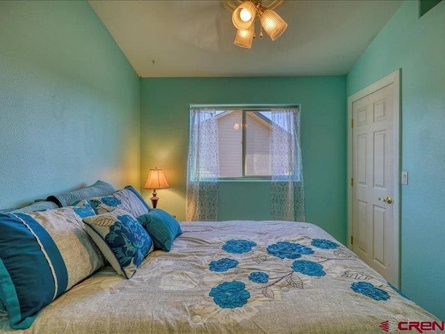 bedroom with vaulted ceiling and ceiling fan