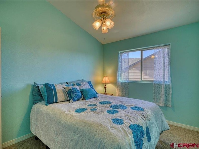 carpeted bedroom featuring ceiling fan and lofted ceiling